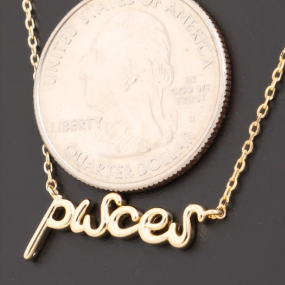 Gold zodiac pendant necklace in a fun font.  Makes a great gift.  18" - Picture 2 of 12